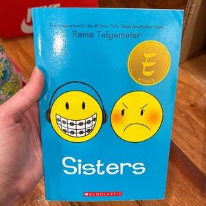 Scholastic Blue 'Sisters' by Raina Telgemeier
